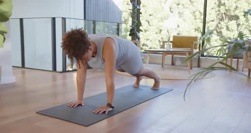 Woman Doing Mountain Climber Exercise on Yoga Mat
