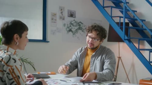 Interior Designer Having Meeting with Client in the Office