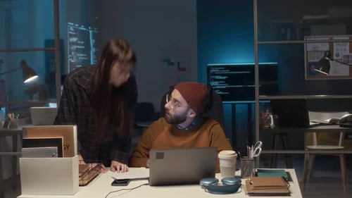Timelapse of IT Developer Sitting at Desk in Office Working on Laptop