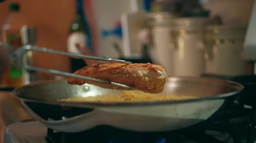 Meat Cooked in Silver Pan being lifted