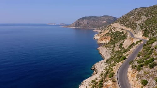 Spectacular View From Drone of Mountain Road Near the Turquoise Sea or Ocean