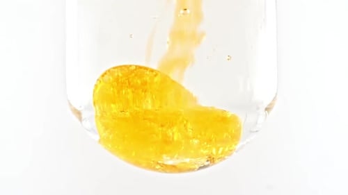 Pouring Yellow Liquid Creates Abstract Composition