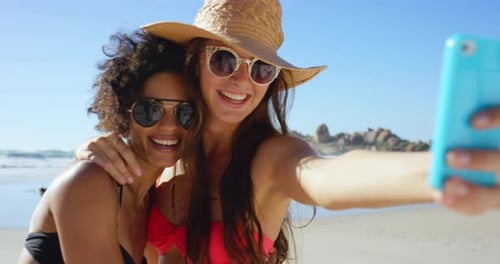 Woman, friends and smile for beach selfie, travel or summer vacation together in the outdoors