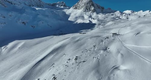Aerial View of Majestic Snow-Covered Mountains in Winter