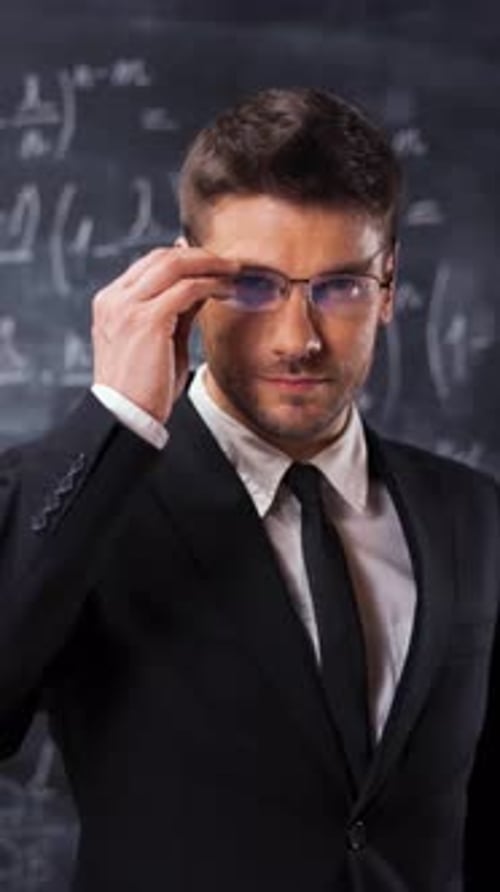 Vertical of Portrait of Scientist Man Standing Near Mathematical Equations Formula