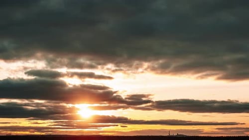 Dramatic Sunset Time-Lapse Over Rural Horizon