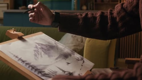 Unrecognizable Male Creator Drawing Landscape on Paper with Pencil