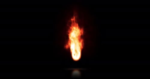 Real Flame of fire burning, isolated torch in the dark and reflecting off the floor.