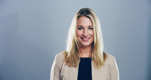 Woman Smiling and Blowing a Kiss to Camera