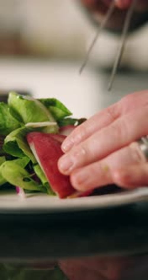 Salad, plate and chef with presentation of food for culinary, meal prep and dinner in restaurant
