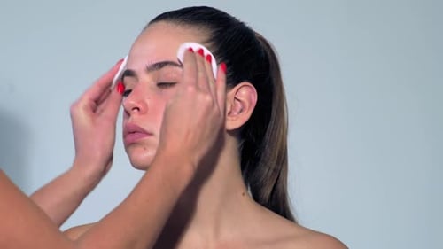 Professional Makeup Artist Working with Beautiful Young Woman Make Up for Sexy Model Makeup Artist