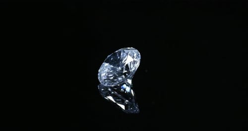 still life of diamond that shines thanks to precious stones and its highest value on a black backg