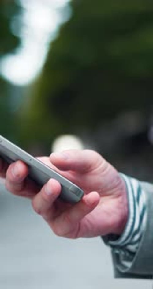 City, phone and hands of businessman typing for social media, communication and networking