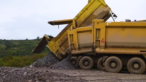 Trucks Unload Their Cargo