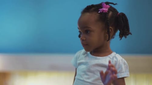 Portrait of Lovely Afroamerican Little Girl Looking Around Indoors Beautiful Small Kid Girl with