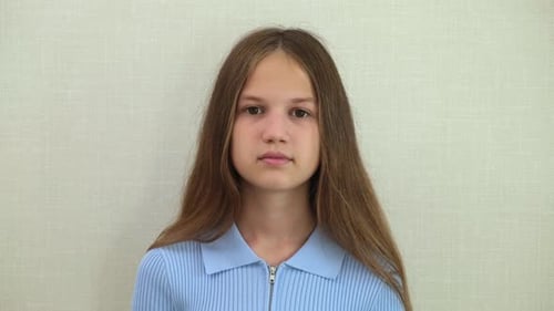 Teen Girl Smiling and Looking at the Camera