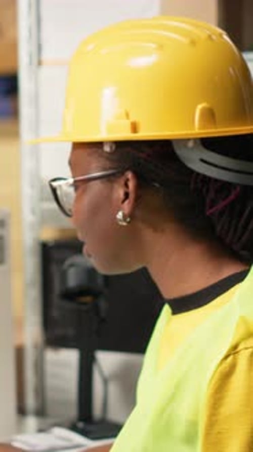 Vertical Video African American Female Verifying the Shipment Details on Awb Labels