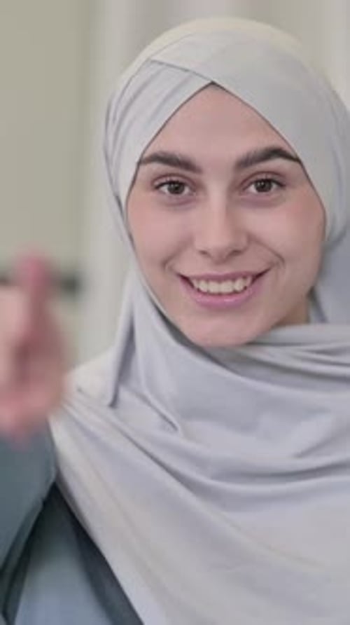 Young Arab Woman Pointing at Camera, Inviting , vertical video