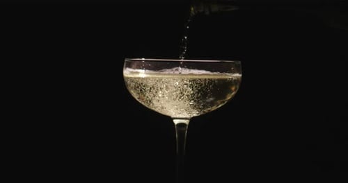 Champagne Prosecco Sparkling Texture in Slow Motion Champagne Pouring Creates Festive Slow Motion