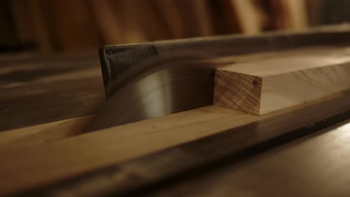 Closeup Saw Machine Cutting Wooden Piece in Carpentry Workshop. Wooden Plank Preparing