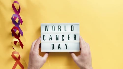 World Cancer Day Message with Colorful Ribbons