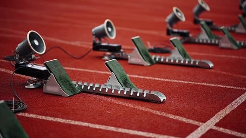Close-up of Starting Blocks on Orange Running Track