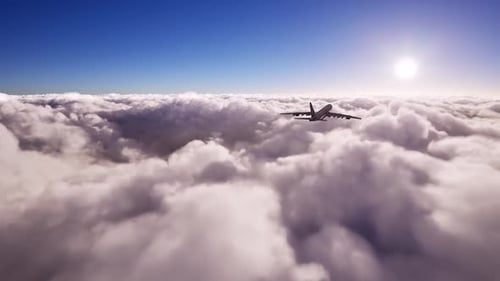 Large Passenger Airplane Flying Over Clouds on Blue Sky