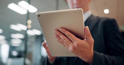 Hands, tablet and business person in office with typing in corridor, scroll