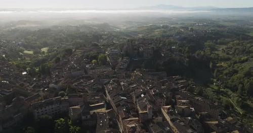 Aerial view of medieval town and rooftops, Italy.