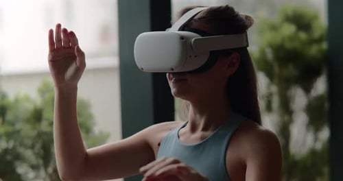 Woman Experiencing Virtual Reality in a Modern Home