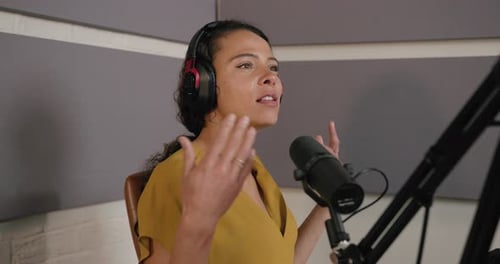 Female Podcaster Recording in a Studio, Radio talk show, Wearing Headphones