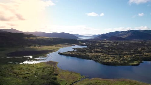 Epic Aerial Beautiful Summer Iceland Landscape Paradise Background Sun Flare. River Through Mountain