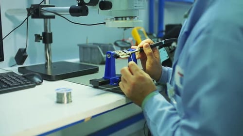 Soldering is done on the microchips in the factory with a soldering electronic working hands.4.