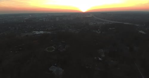 The Sun Setting Over A City