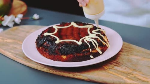 Chef Decorating Cake with White Frosting