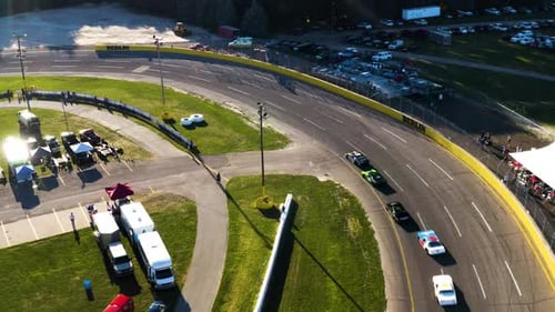 Stock Cars Race on a Paved Racetrack