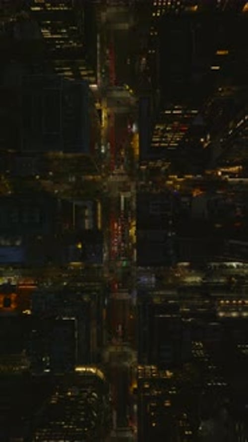 Vertical Night Views of Manhattan New York City Highlight Illuminated Streets in Slow Motion and