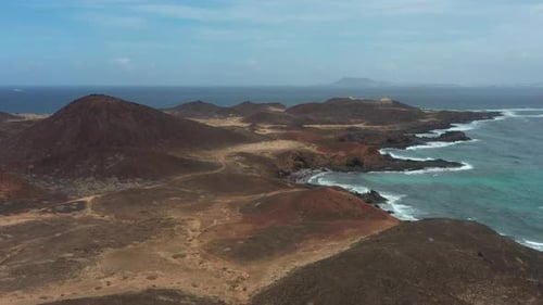 Aerial Drone View of Isla de Lobos Volcanic Coast and Desert Landscape, Canary Islands, Spain