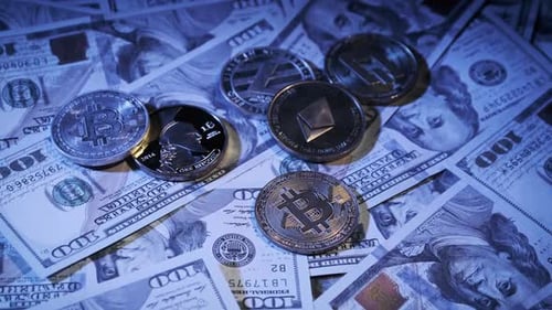 Symbolic Coins of Bitcoin and Altcoins Rotate on Banknotes of One Hundred Dollar