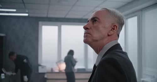 Office Robbery Case Close Up of Male Detective Examining Crime Scene