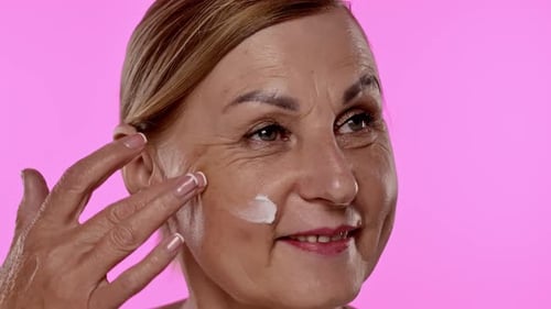 Thoughtful Mature Woman with Hand on Face Close Up