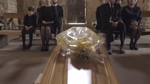 Mourners at funeral service in church