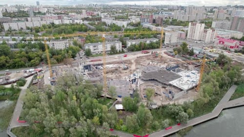 Urban Landscape Reveals View of Huge Construction Site with Cranes Working Nonstop