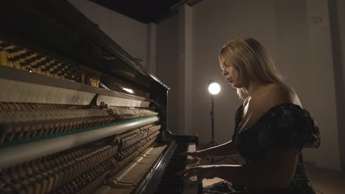 Caucasian Attractive Blond Woman Musician Playing Practicing Piano Instrument in Studio, Open