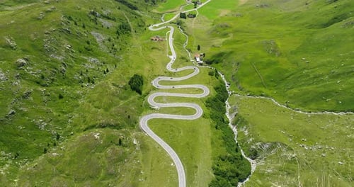 Aerial View Of Vehicles Driving On Julier Pass And Gelgia River In Summer In Switzerland.