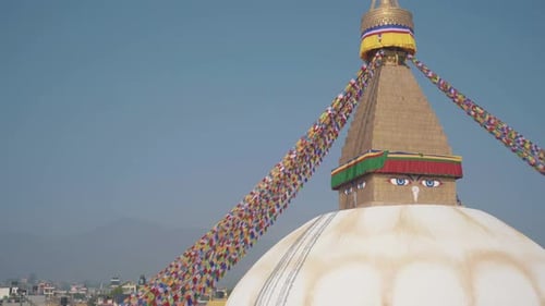 Beautiful Boudhanath Stupa In Kathmandu, Nepal With Colorful Flags Swaying On The Wind Under The Cle