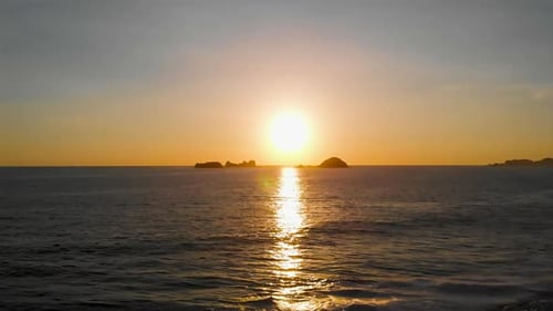 ocean in the beautiful sunset. The beach seen by drone