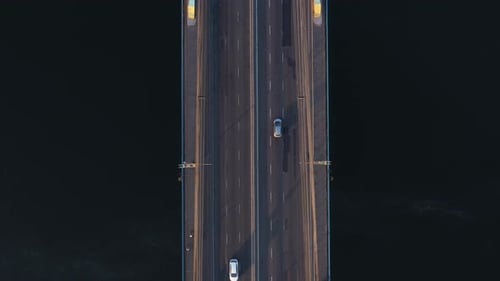 Aerial View of a River Bridge with Moderate Car Traffic