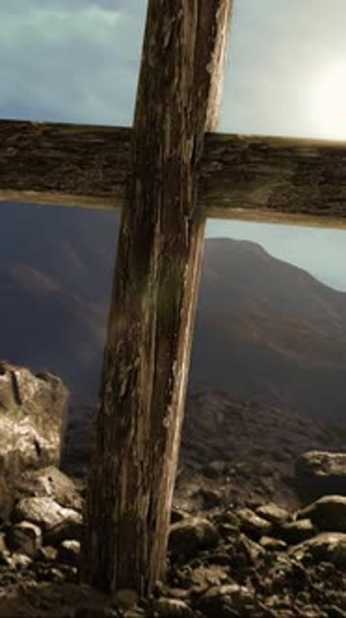 A Close Up Of A Wooden Cross In A Rocky Landscape