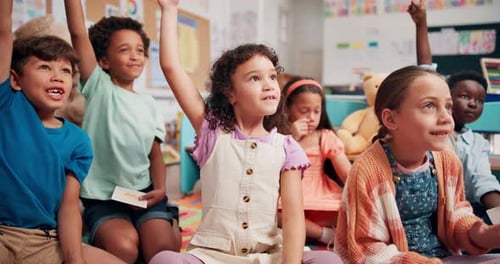 Enthusiastic Children Raise Hands in Classroom
